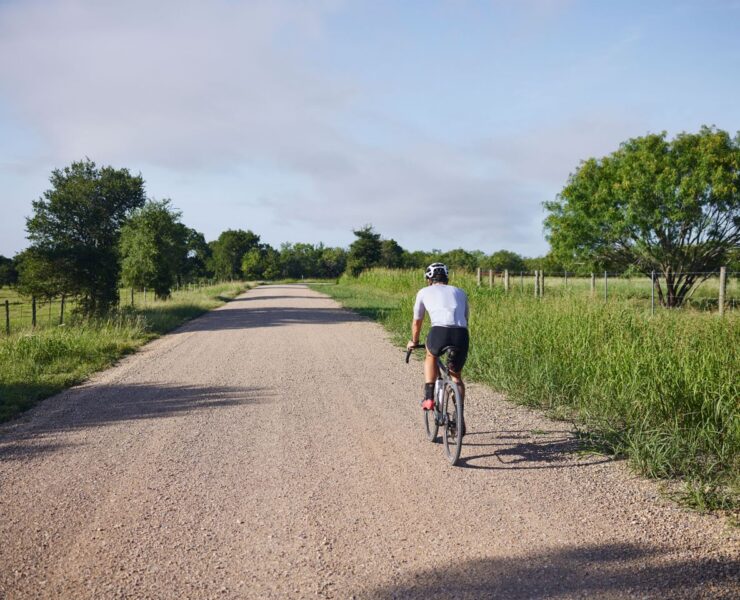 Lone gravel rider on dirt road