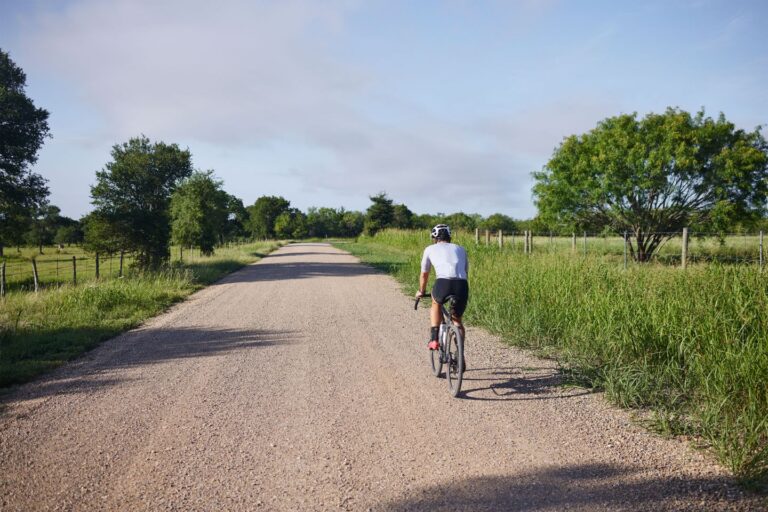 Lone gravel rider on dirt road