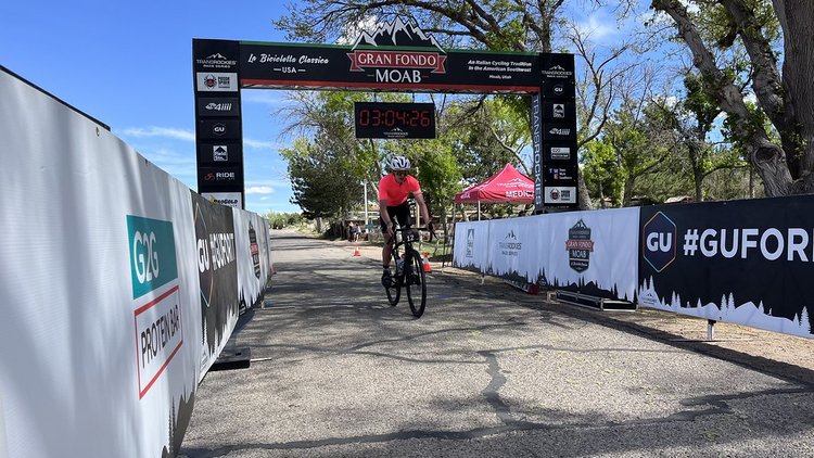 Rider at finish line of Moab Gran Fondo