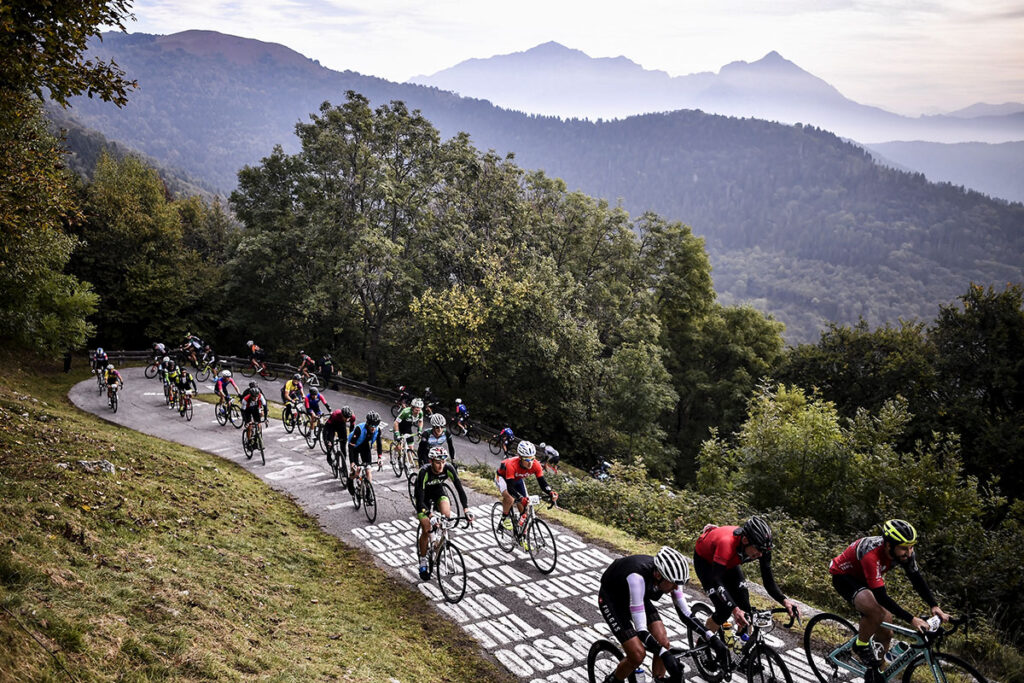 Pack of riders on climb of Gran Fondo Il Lombardia