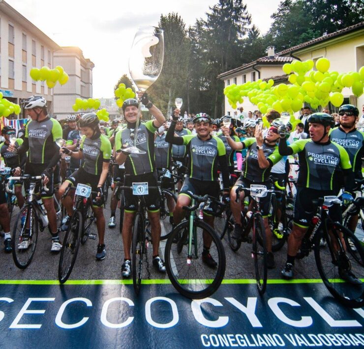 Riders drinking Prosecco at start of Prosecco Gran Fondo