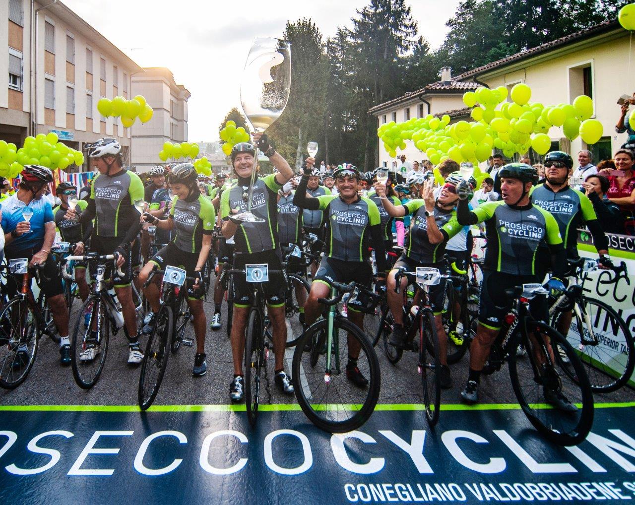 Riders drinking Prosecco at start of Prosecco Gran Fondo