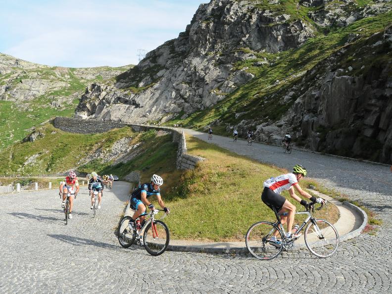 Riders climbing a Swiss mountain pass