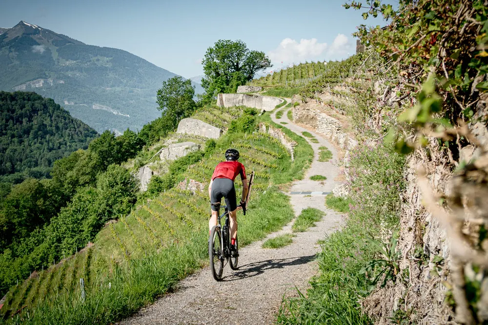 Solo riding climbing on route of UCI Gravel Suisse