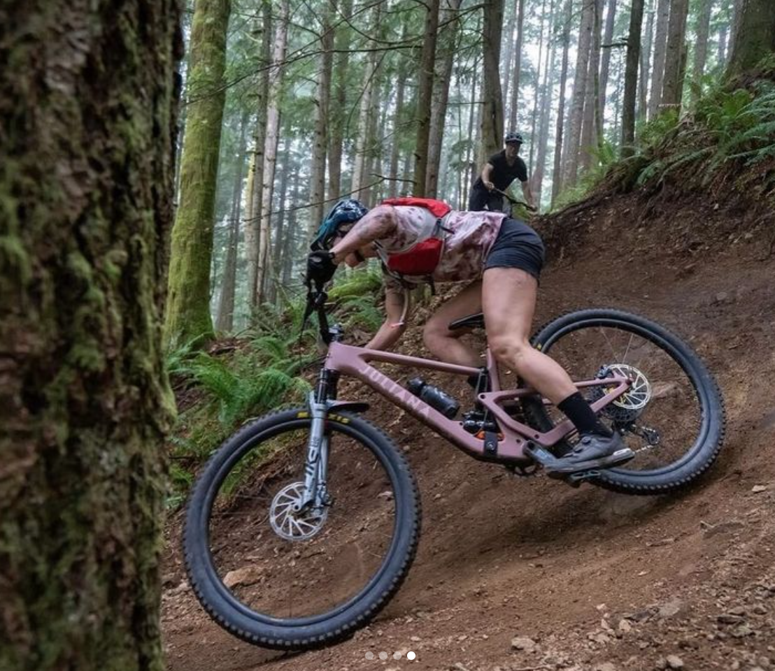 woman mountain biking at sturdy dirty