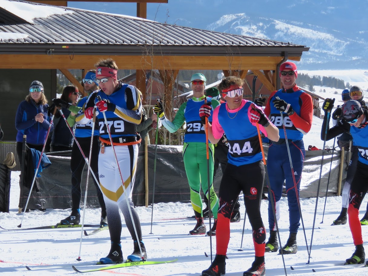 Close-up candid image of seven skiers preparing for the Snow Mountain Ranch Stampede starting line