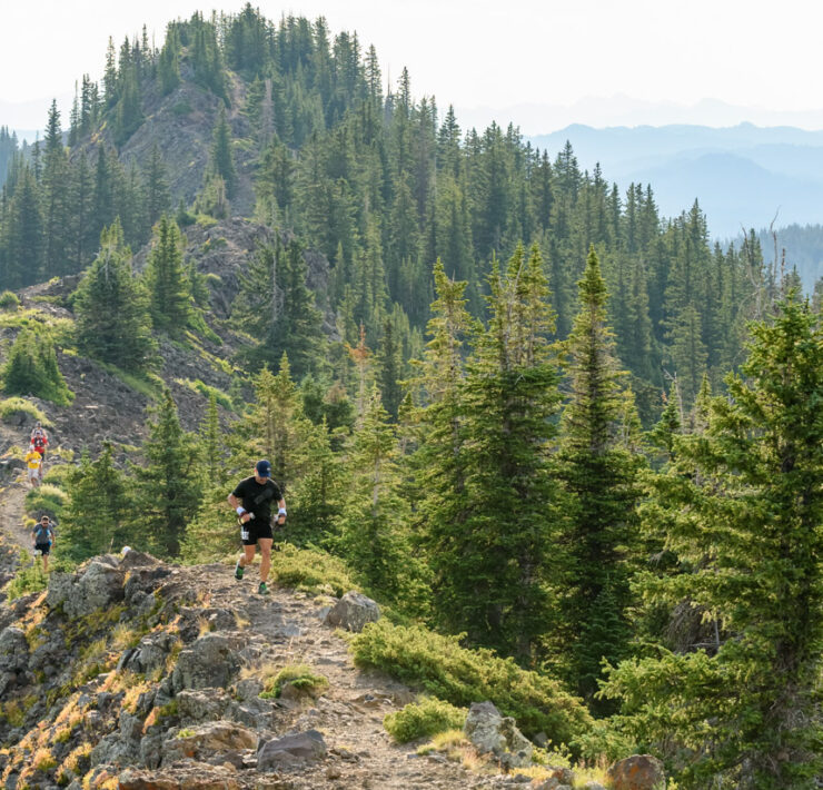 trail runner along ridgeline at Grand Mesa Ultras