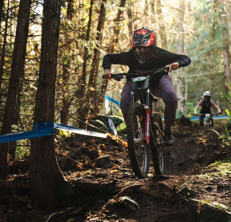 female mountain biker riding at the dirty downhill