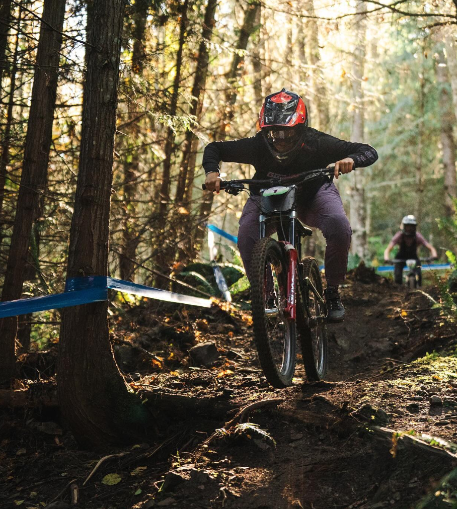 female mountain biker riding at the dirty downhill